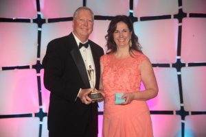 Deanna Frazier with Jim Bugg, Jr., Decorating Den Interiors president and CEO.